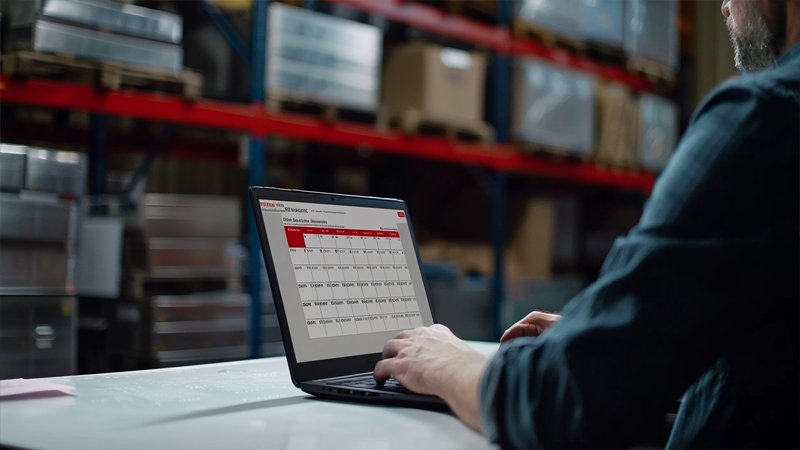 alt="A person working in the warehouse"